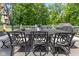 Outdoor dining set and grill on a spacious wood deck with white railings, perfect for entertaining guests at 7016 Royal Oakland Way, Indianapolis, IN 46236