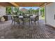 Cozy covered patio with an outdoor dining set, perfect for alfresco meals and relaxation at 7016 Royal Oakland Way, Indianapolis, IN 46236