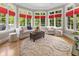 Cozy sunroom with neutral furniture, ottoman, and large windows with views at 7016 Royal Oakland Way, Indianapolis, IN 46236