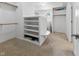Walk-in closet with custom shelving, built-ins and a round window for natural light at 7016 Royal Oakland Way, Indianapolis, IN 46236