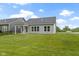 View of the home from the backyard showcasing the exterior and porch at 7248 Covington St, Lebanon, IN 46052