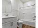 Clean bathroom with white cabinetry, a shower-tub combination, and vinyl plank flooring at 7248 Covington St, Lebanon, IN 46052