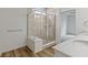 Modern bathroom featuring a glass-enclosed shower and granite countertops at 7248 Covington St, Lebanon, IN 46052