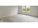 Cozy bedroom with soft carpet and a double window overlooking the yard at 7248 Covington St, Lebanon, IN 46052