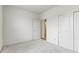 Bedroom showcasing neutral carpeting, white walls, closet, and paneled door at 7248 Covington St, Lebanon, IN 46052