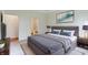 Comfortable bedroom featuring a gray bed frame, soft carpet, and stylish wall art at 7248 Covington St, Lebanon, IN 46052