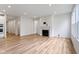 Bright living room featuring a fireplace, hardwood floors, and recessed lighting at 7248 Covington St, Lebanon, IN 46052