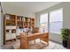 Bright office with built-in shelving, large windows, and a spacious wooden desk at 7248 Covington St, Lebanon, IN 46052