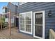 Exterior view of the backyard and deck, with the door leading inside at 7510 Harbour, Indianapolis, IN 46240