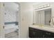 Bathroom featuring a tub with tiled wall, and modern fixtures at 7510 Harbour, Indianapolis, IN 46240