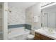Bathroom featuring a tub with tiled wall, and wood vanity at 7510 Harbour, Indianapolis, IN 46240