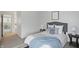 Bedroom with blue bedding and decor, featuring an open doorway at 7510 Harbour, Indianapolis, IN 46240