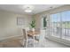 Cozy dining area with large windows and access to the outdoor living space at 7510 Harbour, Indianapolis, IN 46240