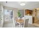 Dining area with lots of natural light, modern furnishings, and a backyard view at 7510 Harbour, Indianapolis, IN 46240
