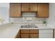 Charming kitchen features stainless steel sink and ample cabinet space at 7510 Harbour, Indianapolis, IN 46240