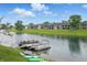Pontoon boats on shore with views of lakefront homes at 7510 Harbour, Indianapolis, IN 46240