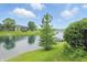 Scenic water and community view with lush green lawn in foreground at 7510 Harbour, Indianapolis, IN 46240