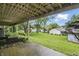 A covered patio provides shade, and the lush backyard is perfect for recreation and enjoying nature at 7940 Sunfield Ct, Indianapolis, IN 46214