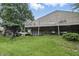 Exterior showcasing a well-maintained lawn and stone foundation with an upper deck area at 7940 Sunfield Ct, Indianapolis, IN 46214
