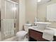 Clean bathroom featuring a shower, tile floors, a modern vanity, and fresh towels at 7940 Sunfield Ct, Indianapolis, IN 46214