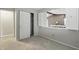 Bright bedroom featuring neutral walls, carpet flooring, closet, and an opening to a living area at 7940 Sunfield Ct, Indianapolis, IN 46214