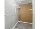 Walk-in closet with shelving and wood-look flooring at 7940 Sunfield Ct, Indianapolis, IN 46214