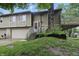 Charming split-level home with a stone chimney and inviting front entrance at 7940 Sunfield Ct, Indianapolis, IN 46214