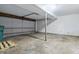 Spacious two-car garage featuring a concrete floor and a large garage door at 7940 Sunfield Ct, Indianapolis, IN 46214