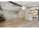 Open living space with hardwood floors and a view of the kitchen at 7940 Sunfield Ct, Indianapolis, IN 46214
