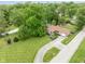 Overhead shot of home, highlighting its well-manicured lawn, mature trees, and convenient driveway at 800 E 104Th St, Carmel, IN 46280