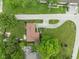 Aerial view of the home, showcasing the roof, driveway, mature trees, and surrounding neighborhood at 800 E 104Th St, Carmel, IN 46280
