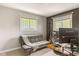Bedroom featuring a couch, desk, and windows with natural light at 800 E 104Th St, Carmel, IN 46280