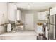 Modern kitchen featuring granite countertops, stainless steel appliances, and white cabinets at 800 E 104Th St, Carmel, IN 46280