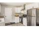 Efficient kitchen with stainless appliances and granite countertops at 800 E 104Th St, Carmel, IN 46280
