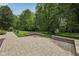 Lovely backyard featuring a stone patio and lush lawn, creating a relaxing outdoor space at 8241 Holmard Pl, Indianapolis, IN 46259