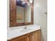 Cozy bathroom with wood accents, vanity, and mirror at 8241 Holmard Pl, Indianapolis, IN 46259