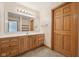 Bathroom featuring tile floors, wood cabinets, and a large vanity at 8241 Holmard Pl, Indianapolis, IN 46259