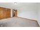 Inviting bedroom featuring a closet, neutral walls, plush carpet, and bright natural lighting at 8241 Holmard Pl, Indianapolis, IN 46259