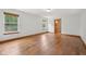Bright bedroom with hardwood floors, two windows, and white walls at 8241 Holmard Pl, Indianapolis, IN 46259