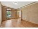 Cozy bedroom with hardwood floors, neutral paint, and abundant natural light at 8241 Holmard Pl, Indianapolis, IN 46259