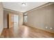 Spacious bedroom featuring hardwood floors, natural light, and neutral decor at 8241 Holmard Pl, Indianapolis, IN 46259
