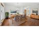 Staged dining room with a dining table, chandelier, and wood floors at 8241 Holmard Pl, Indianapolis, IN 46259