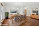 Staged dining room with a dining table, chandelier, and wood floors at 8241 Holmard Pl, Indianapolis, IN 46259