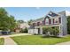 Well-maintained home features lush lawn, three-car garage, and a welcoming front porch at 8241 Holmard Pl, Indianapolis, IN 46259