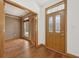 Inviting foyer features hardwood floors, an elegant front door, and leads into an office at 8241 Holmard Pl, Indianapolis, IN 46259