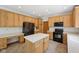 Well-lit kitchen with black appliances and an island with white countertops, great for food preparation at 8241 Holmard Pl, Indianapolis, IN 46259