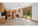 Bright kitchen with light wood cabinetry, black appliances, and a central island perfect for cooking at 8241 Holmard Pl, Indianapolis, IN 46259