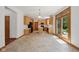 Spacious kitchen with wooden cabinets, an island, and doors opening to the outdoors at 8241 Holmard Pl, Indianapolis, IN 46259