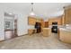 Open concept kitchen with wooden cabinets, black appliances, and an island for entertaining at 8241 Holmard Pl, Indianapolis, IN 46259