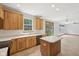 Kitchen area with stainless appliances, countertops, and an adjacent dining area at 8241 Holmard Pl, Indianapolis, IN 46259